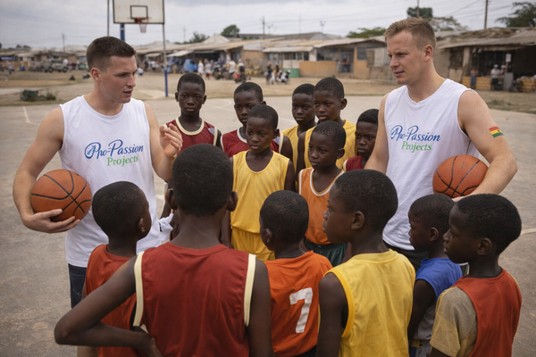 Two basketball intern coaches at James Town Accra during a session with the kids at the courtyard